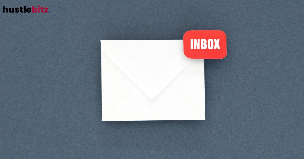 An envelope with a red "INBOX" notification on a gray background.