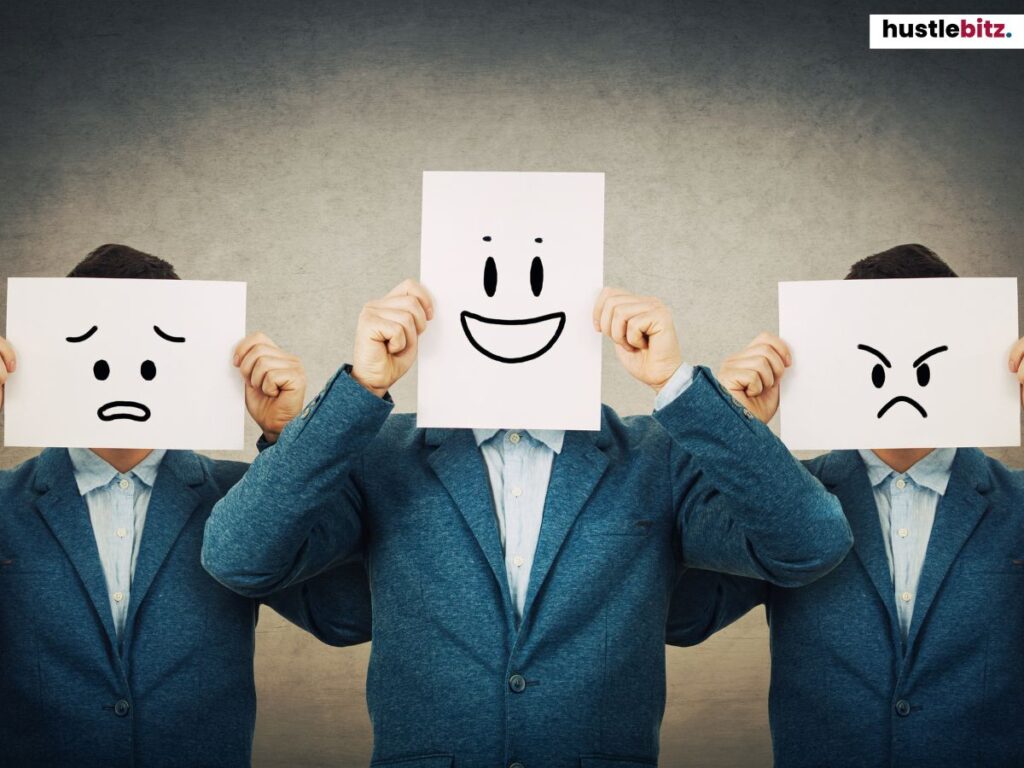 Three men holding emoticon faces, each showing a different emotion.