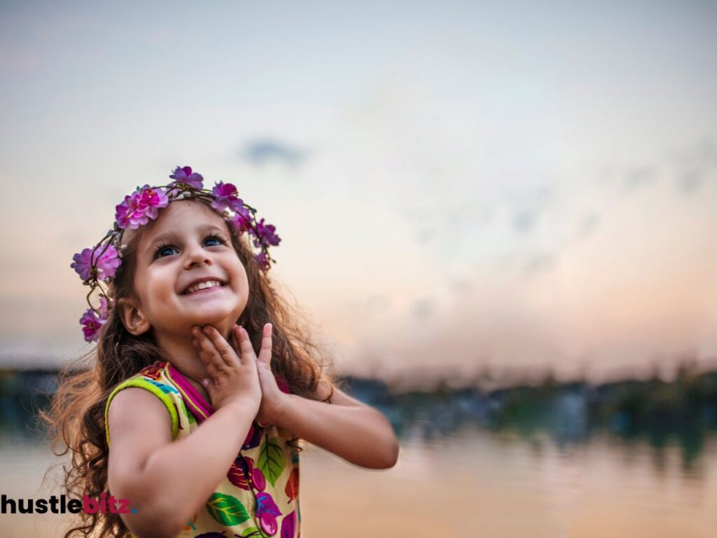Smiling girl with flower crown at sunset.