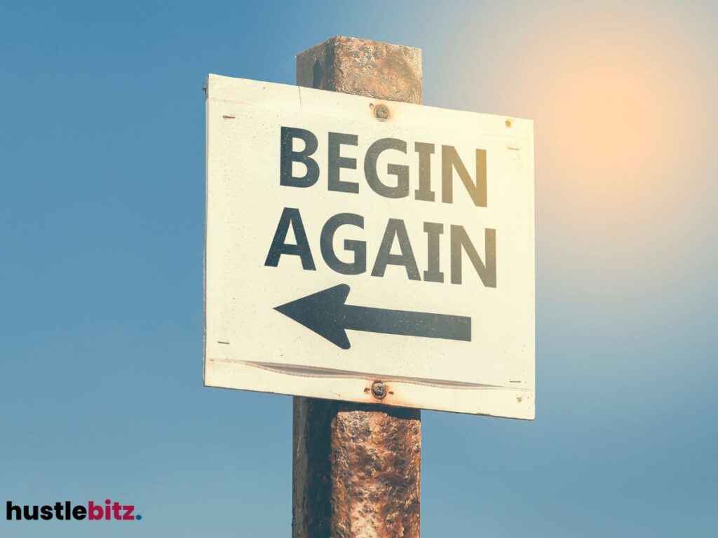"Begin Again" sign with an arrow.