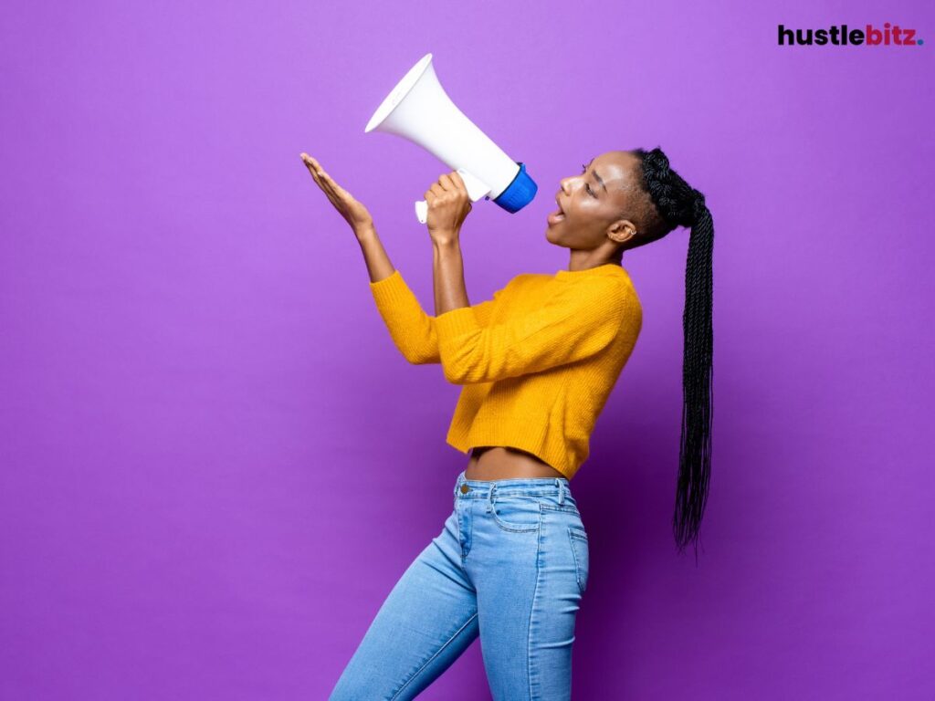Woman speaking through a megaphone.