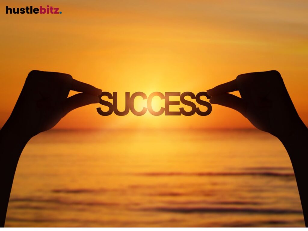 A hand holding a word success with the background of the sea