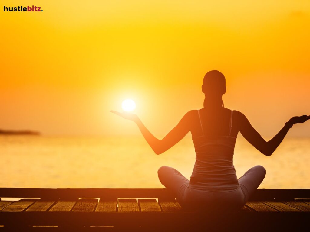 A woman doing meditation beside the sea