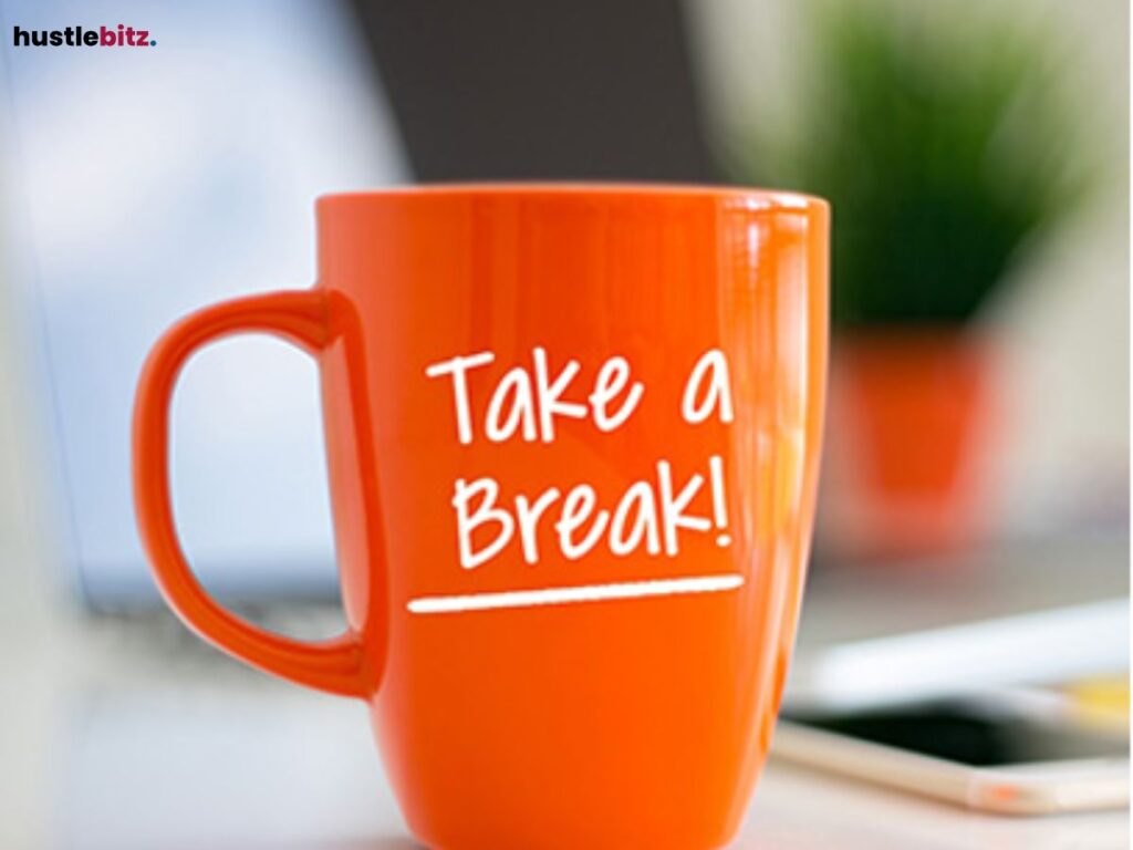 An orange mug with a text " Take a break!".