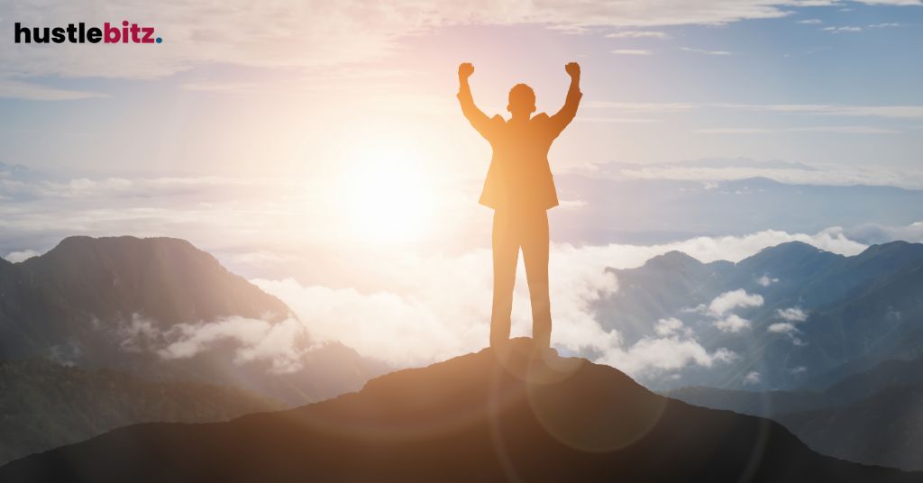 A man raise his two hands showing a victory
