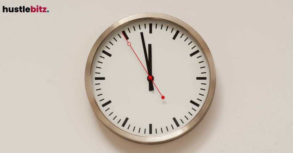 A clock showing the time with a distinct red second hand.