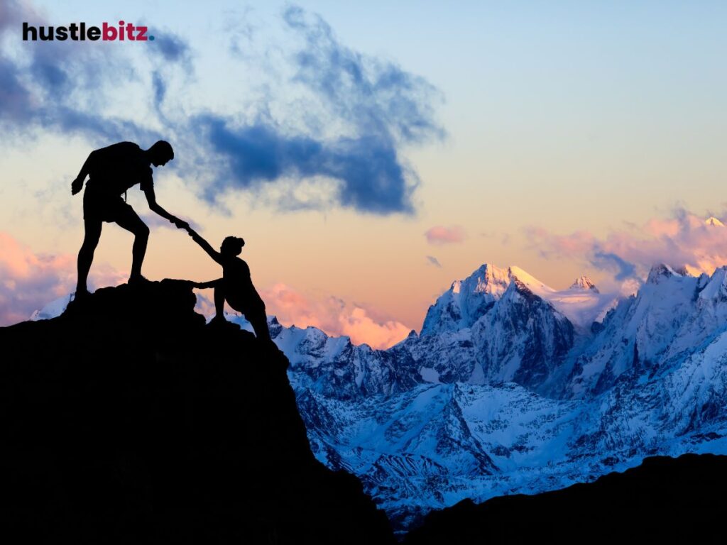 A man and a woman climbing to the mountains