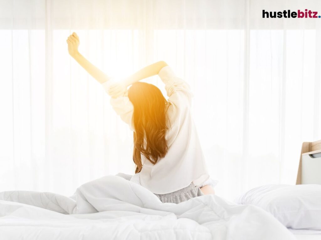 Woman stretching in the morning sunlight.