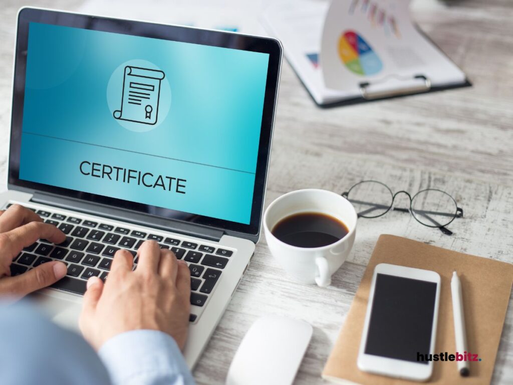 A workspace with the laptop screen showing "certificate"