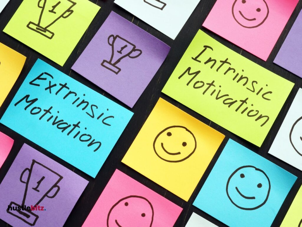 post it notes with words: intrinsic motivation and extrinsic motivation