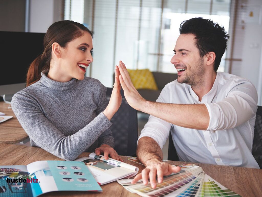 A man and a woman doing hi-five.