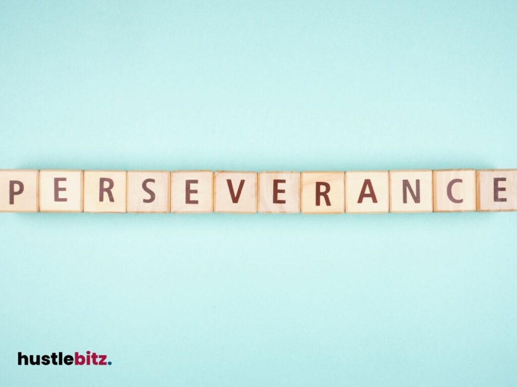 The word "PERSEVERANCE" is spelled with wooden letter blocks on a pastel background.