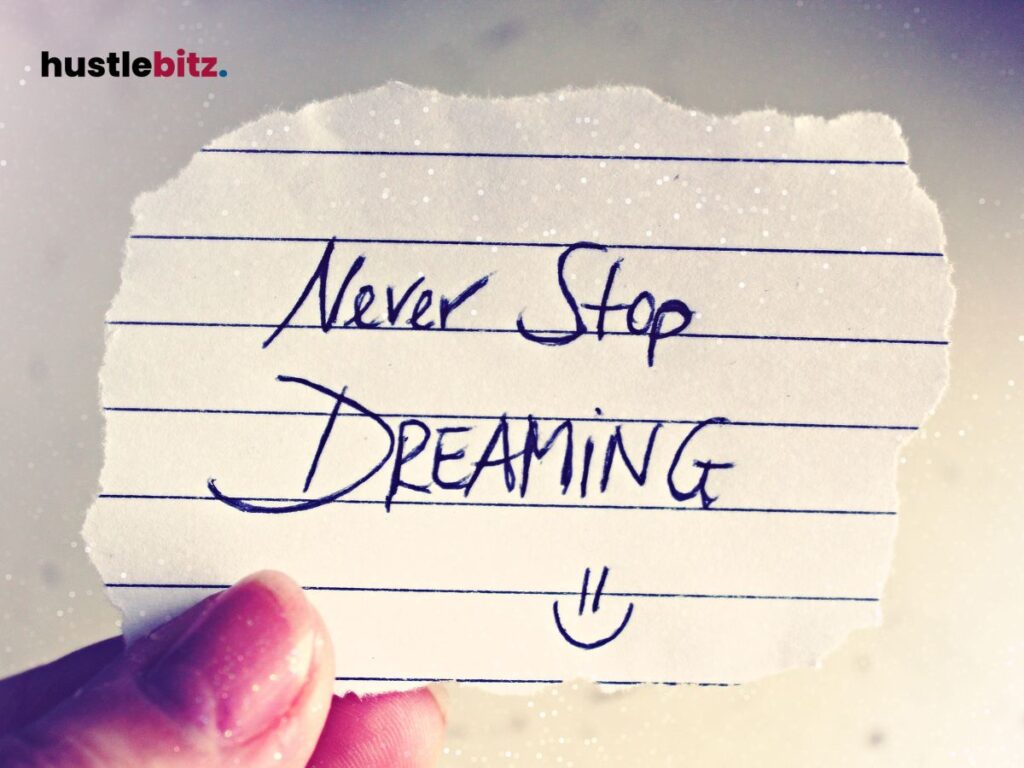 A handwritten note reads "Never Stop Dreaming" with a smiley face on lined paper.

