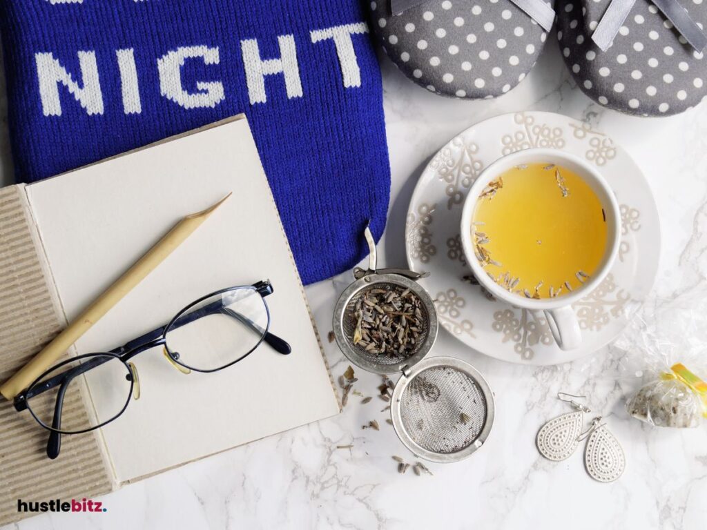 Image of a tea, notebook, and pillows