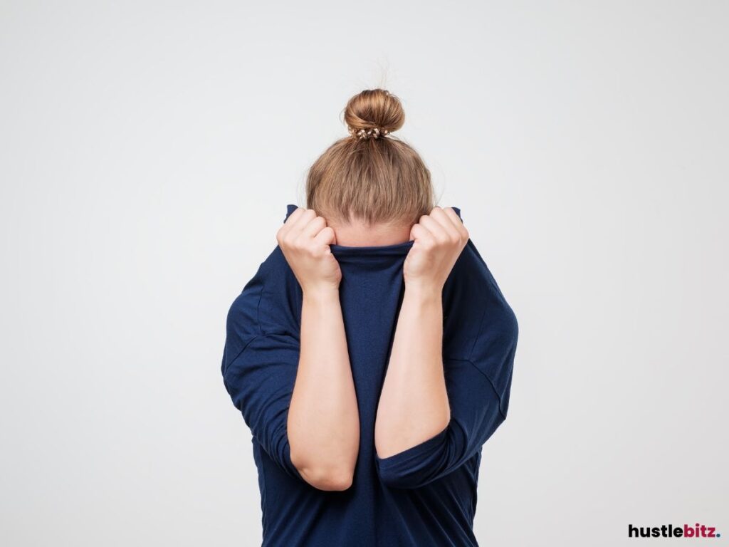 A woman hiding in her shirt