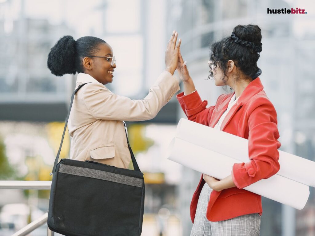 Two women making hi-five