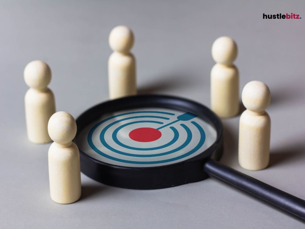 A magnifying glass surrounded with wooden pawns