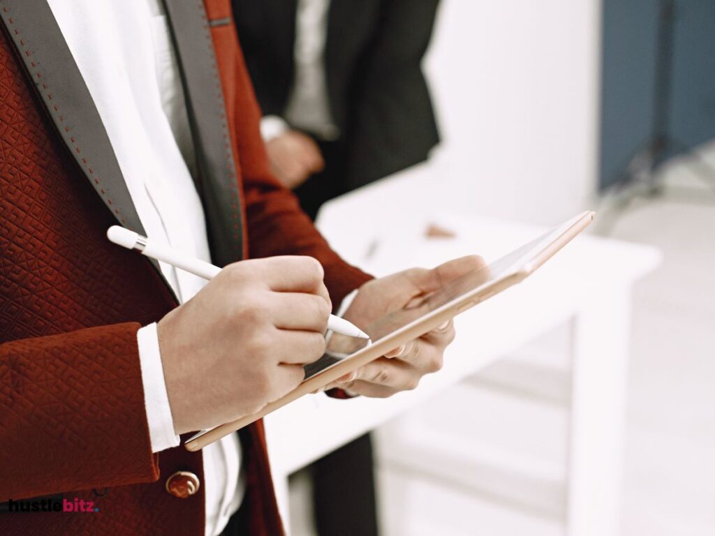 A person taking notes on his tablet