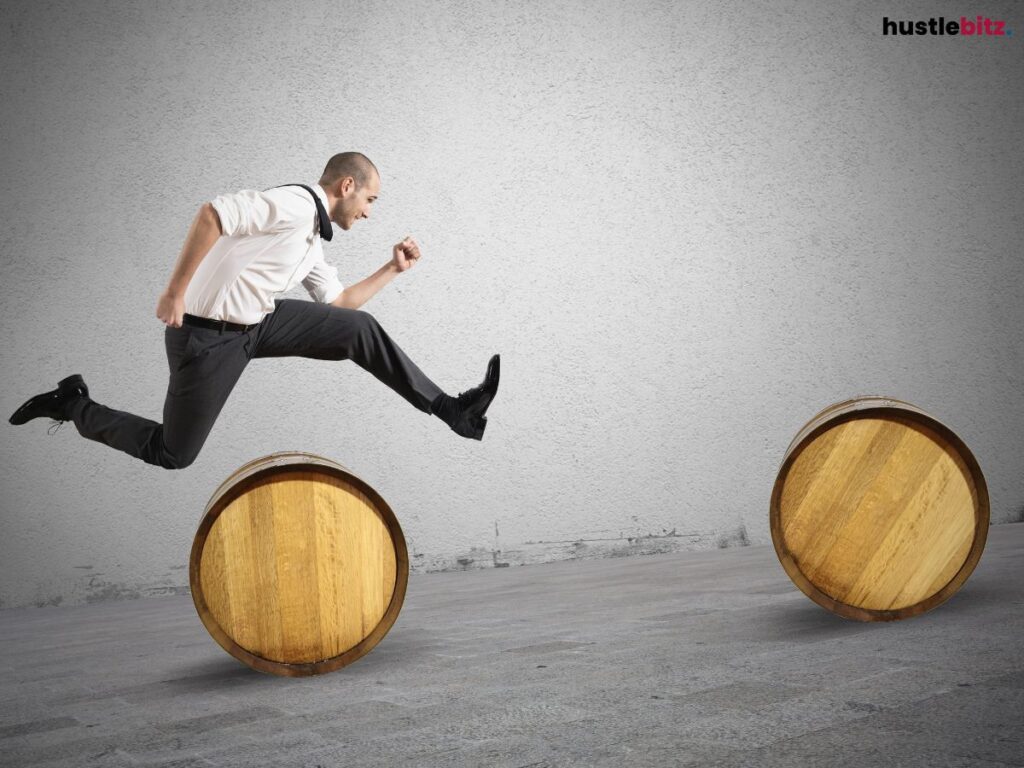 A man jumping through obstacles