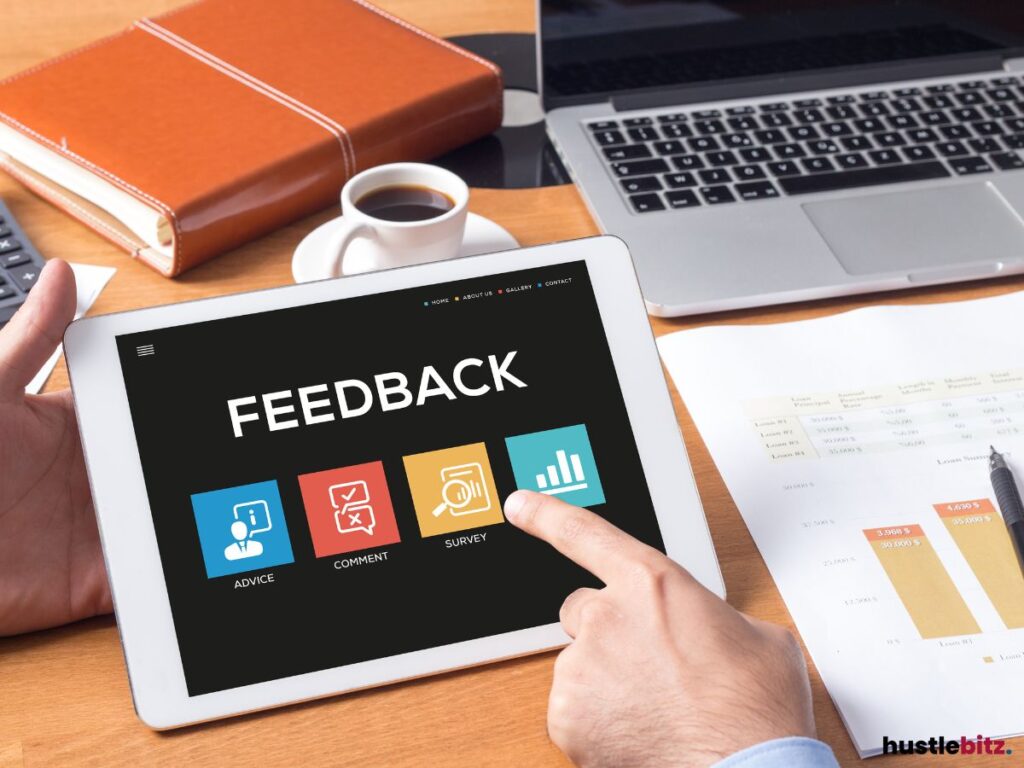 A tablet with the word FEEDBACK on the screen