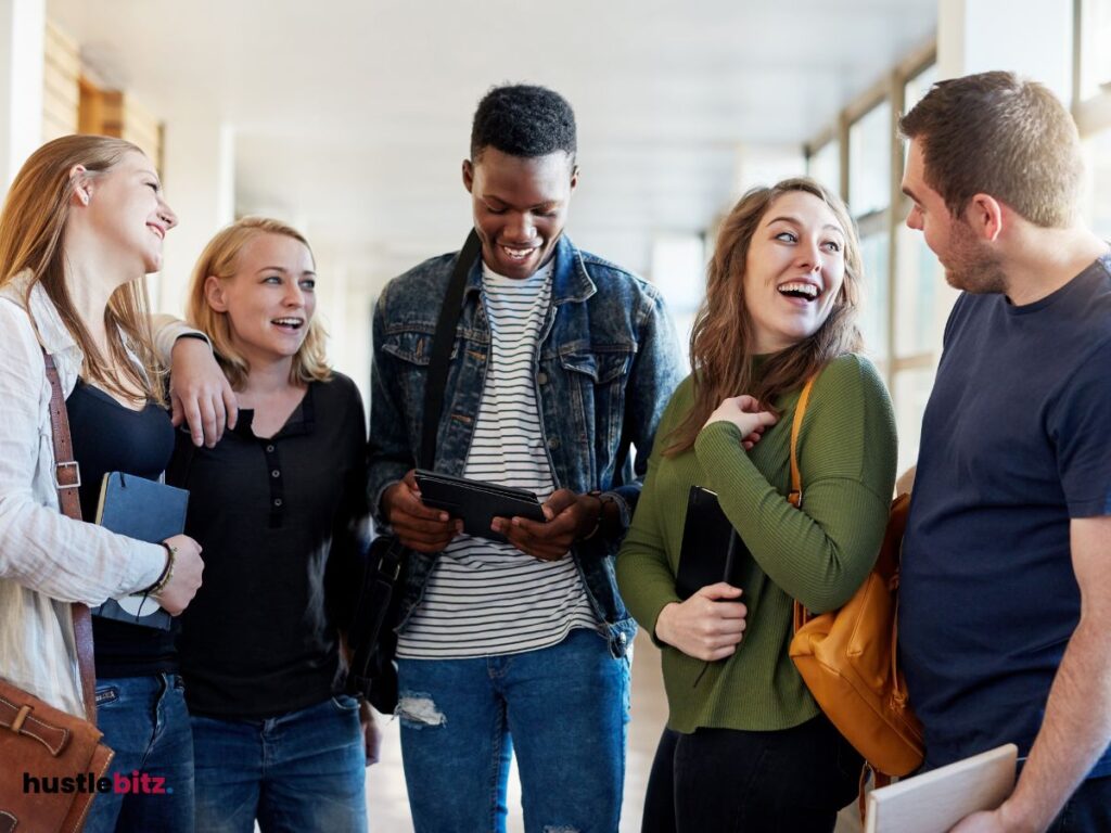 Five people laughing with each other.