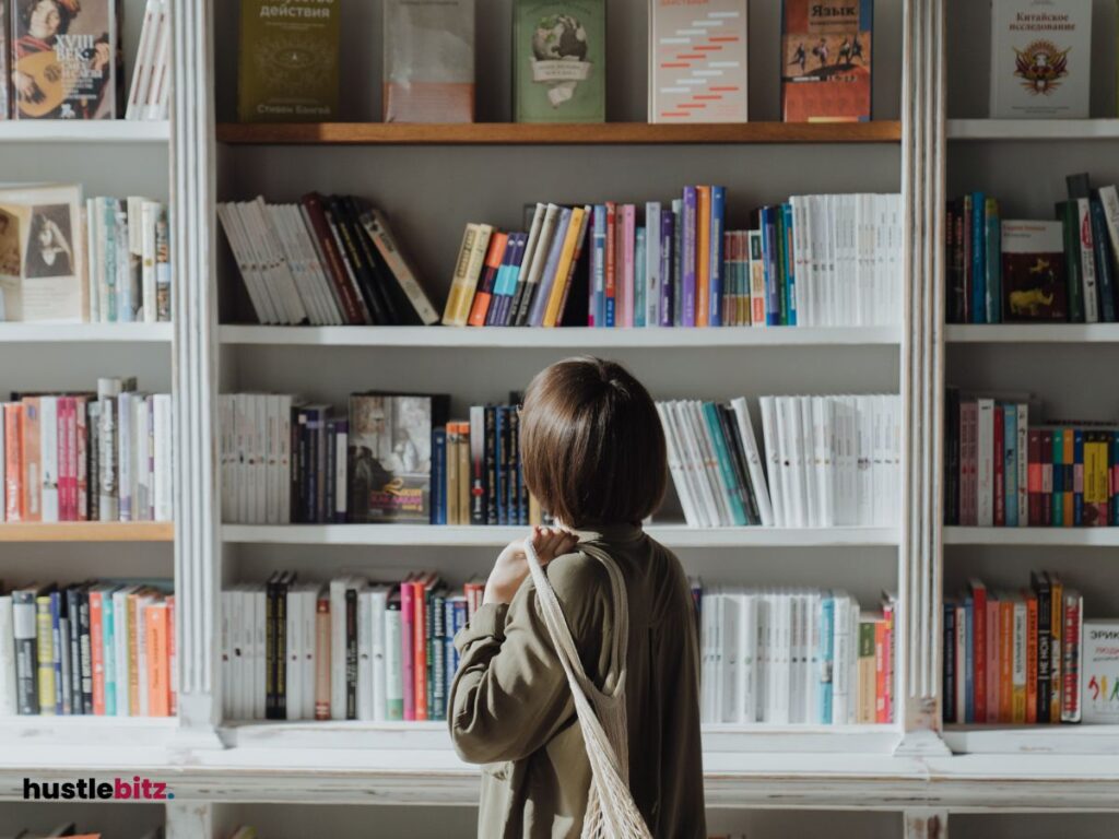 A woman looking at bookshelves