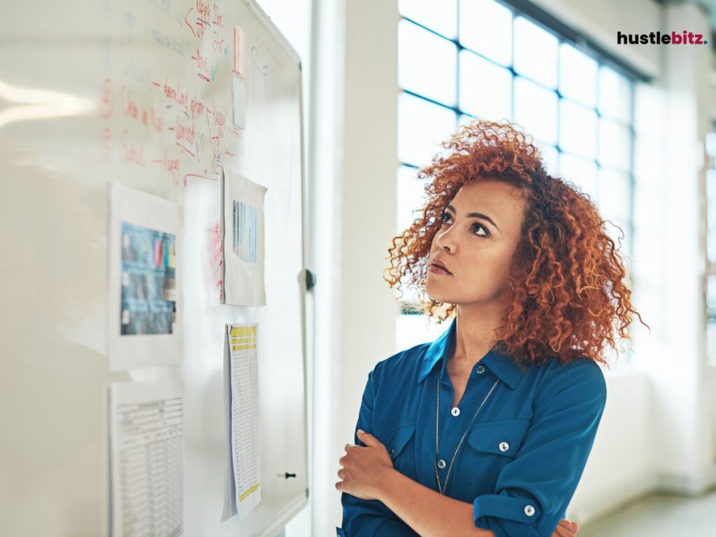 A woman looking at a board