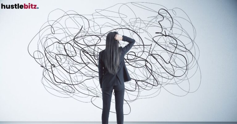 Woman facing tangled scribbles on the wall.