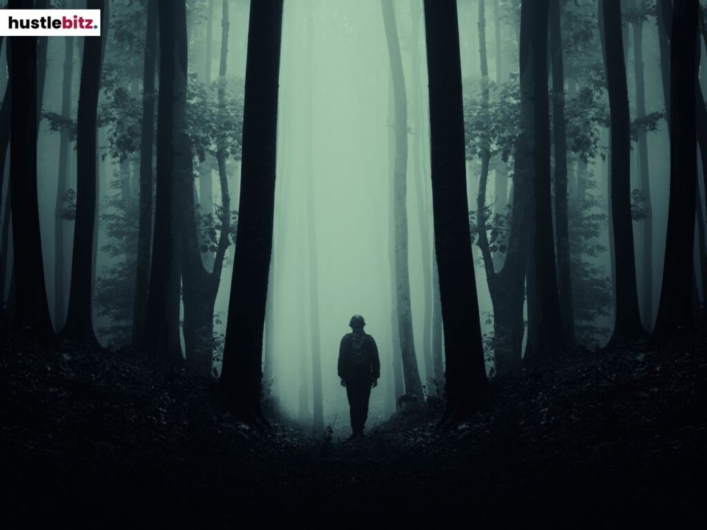 A man walking in the dark forest.
