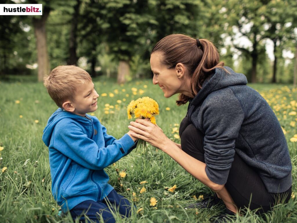 A woman holding a flower given by  a little boy.