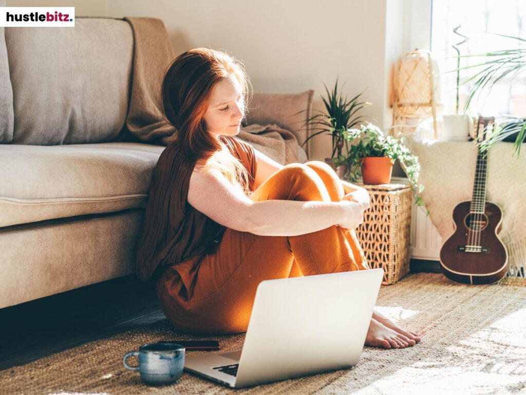 A woman sitting in front of her laptop.