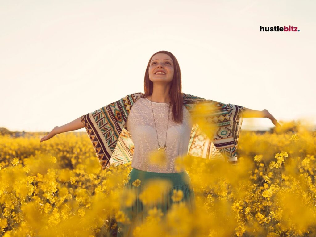 A woman in a field of flowers.