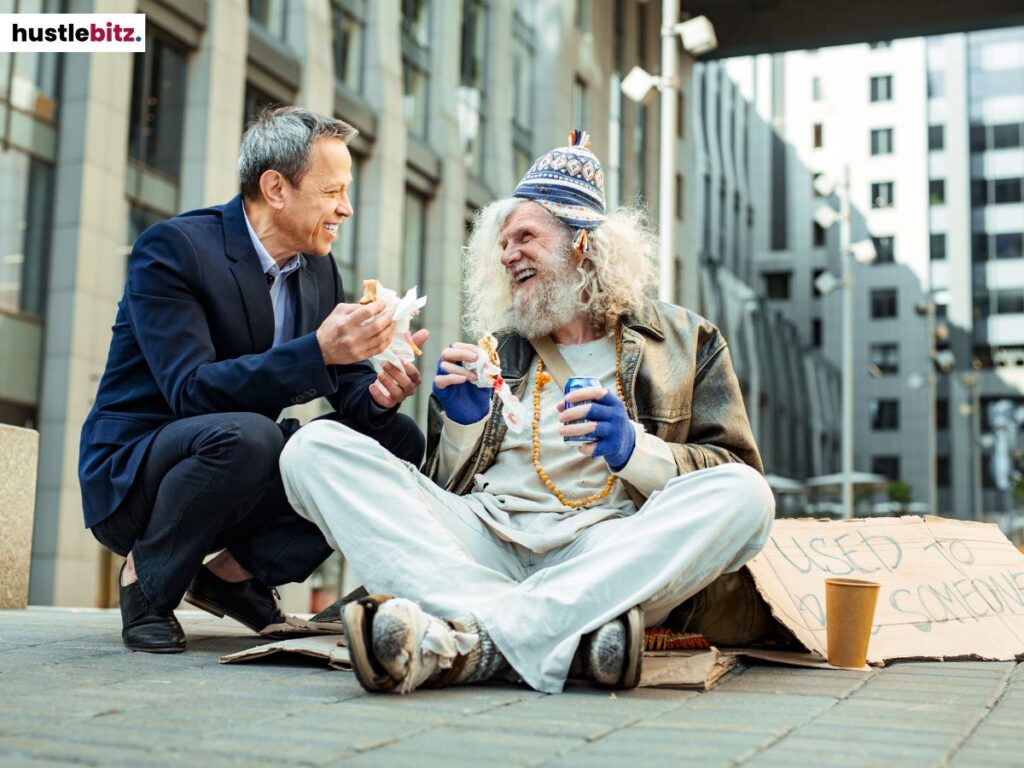 A man in formal attire talking to a homeless man.
