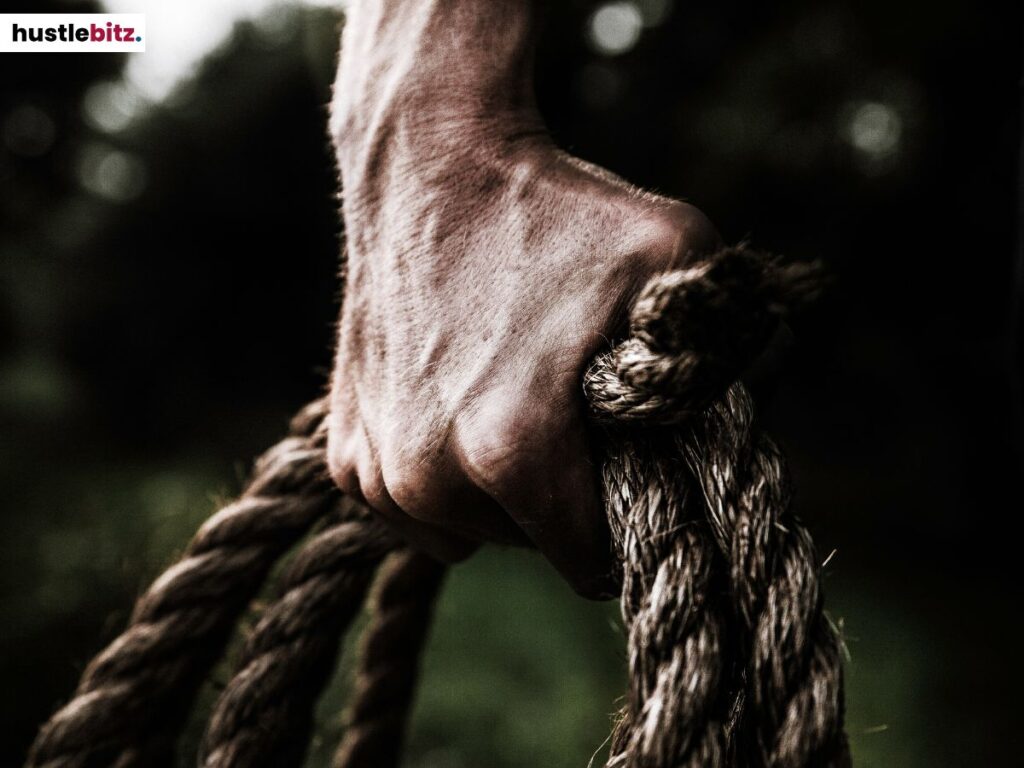 A person holding a rope.