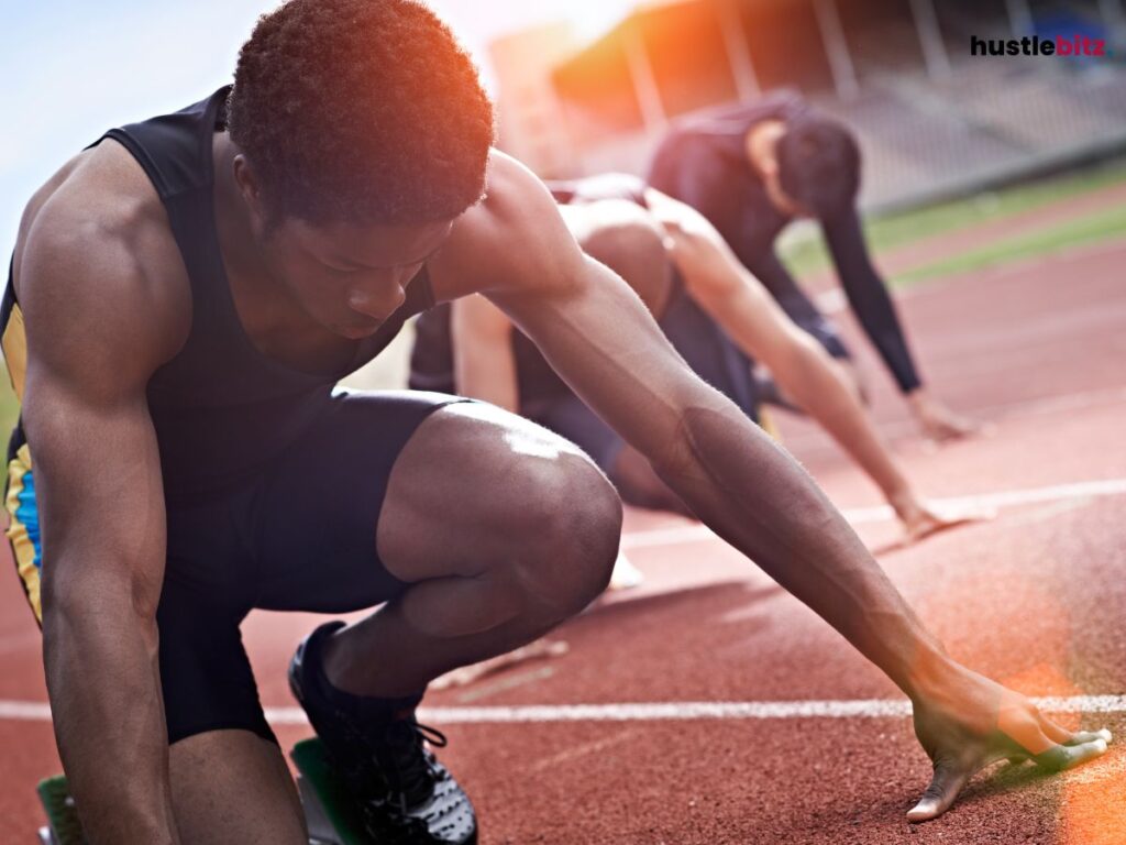 A man focusing on running on track.