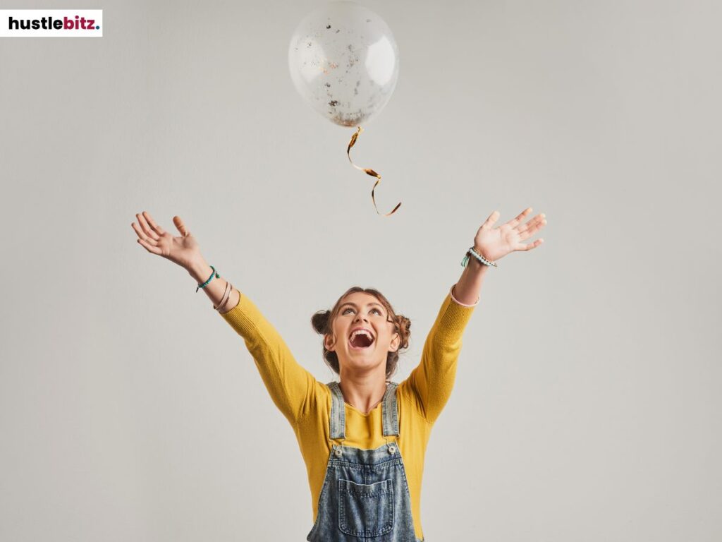 A woman playing with a balloon.