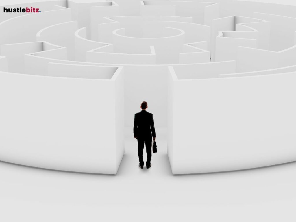 A man in a suit standing at the entrance of a giant maze, contemplating.