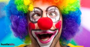 A person dressed as a clown with a wide-eyed making a funny face.